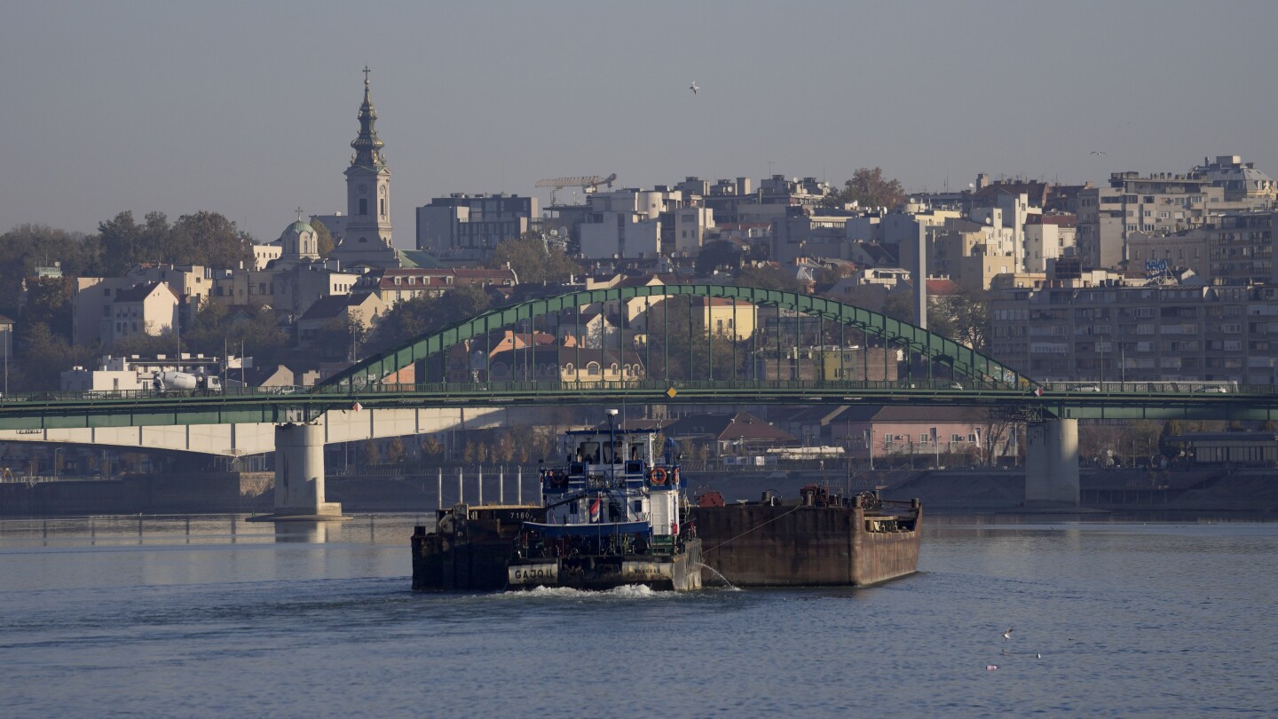 Vessel loaded with fertilizer sinks in the Danube in Serbia, prompting environmental fears | AP News