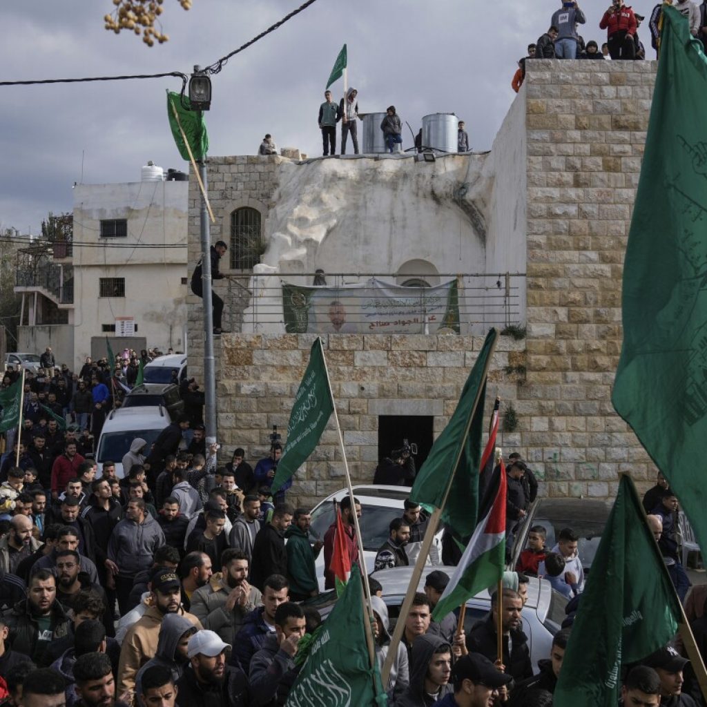 Hezbollah leader says his group must retaliate for suspected Israeli strike in Beirut | AP News