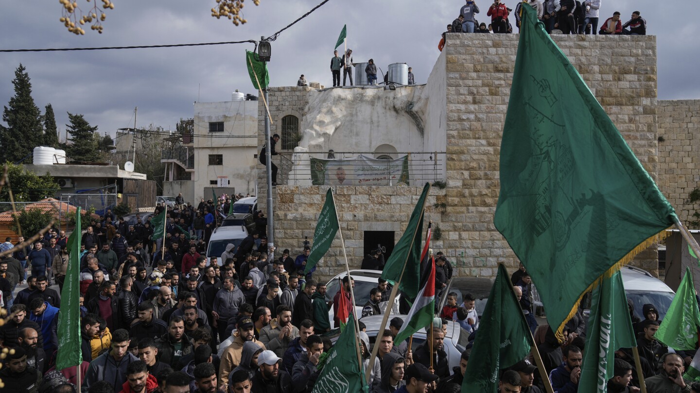 Hezbollah leader says his group must retaliate for suspected Israeli strike in Beirut | AP News