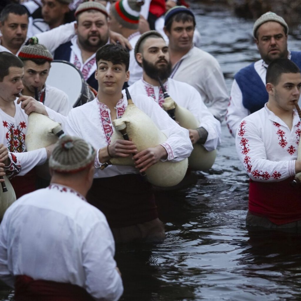 Bulgarians celebrate the feast of Epiphany with traditional rituals | AP News