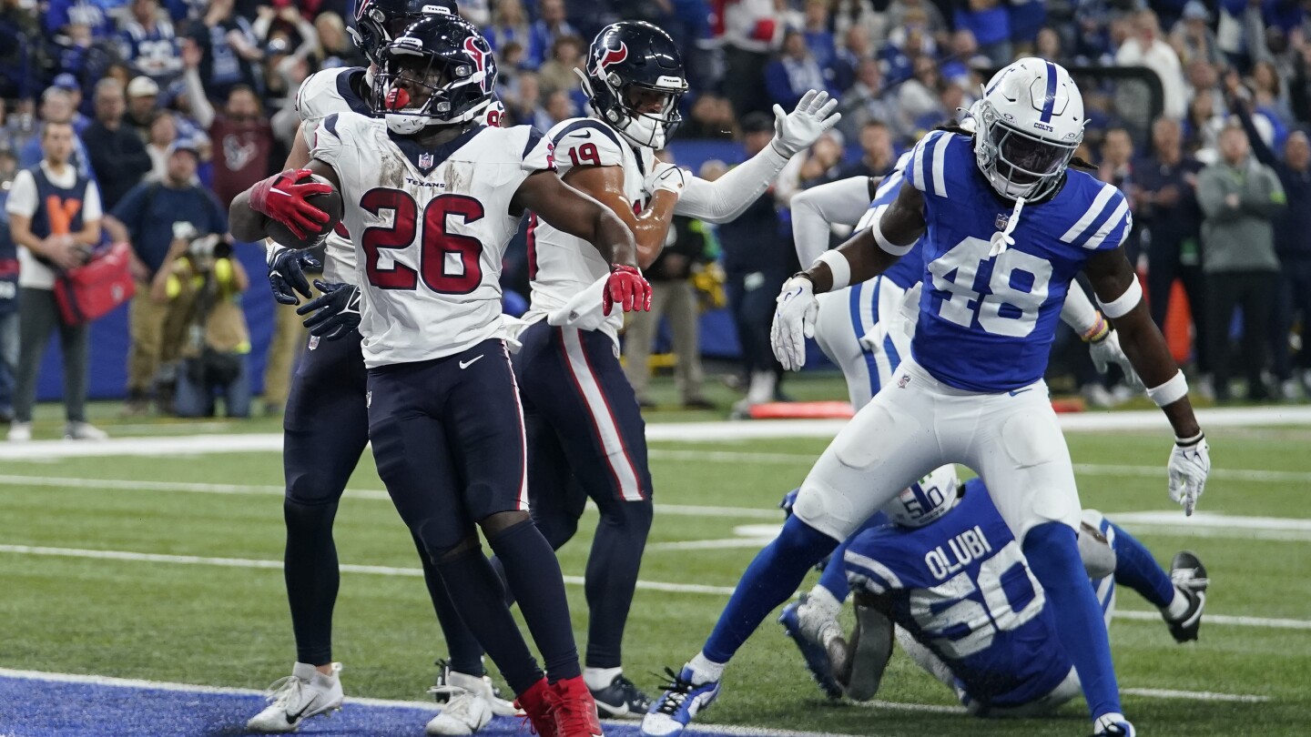 Texans wrap up playoff spot with 23-19 victory over Colts | AP News