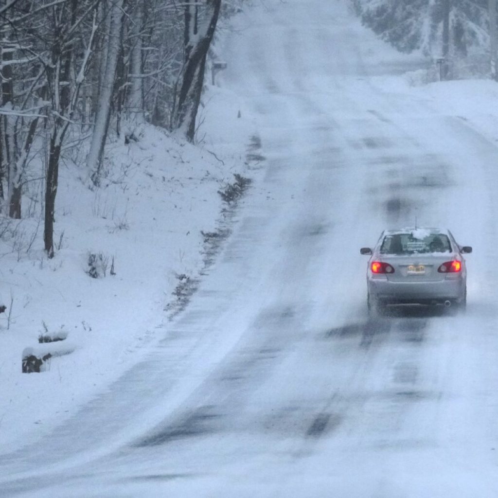 Major winter storms bring snow, ice and travel hazards to both US coasts | AP News