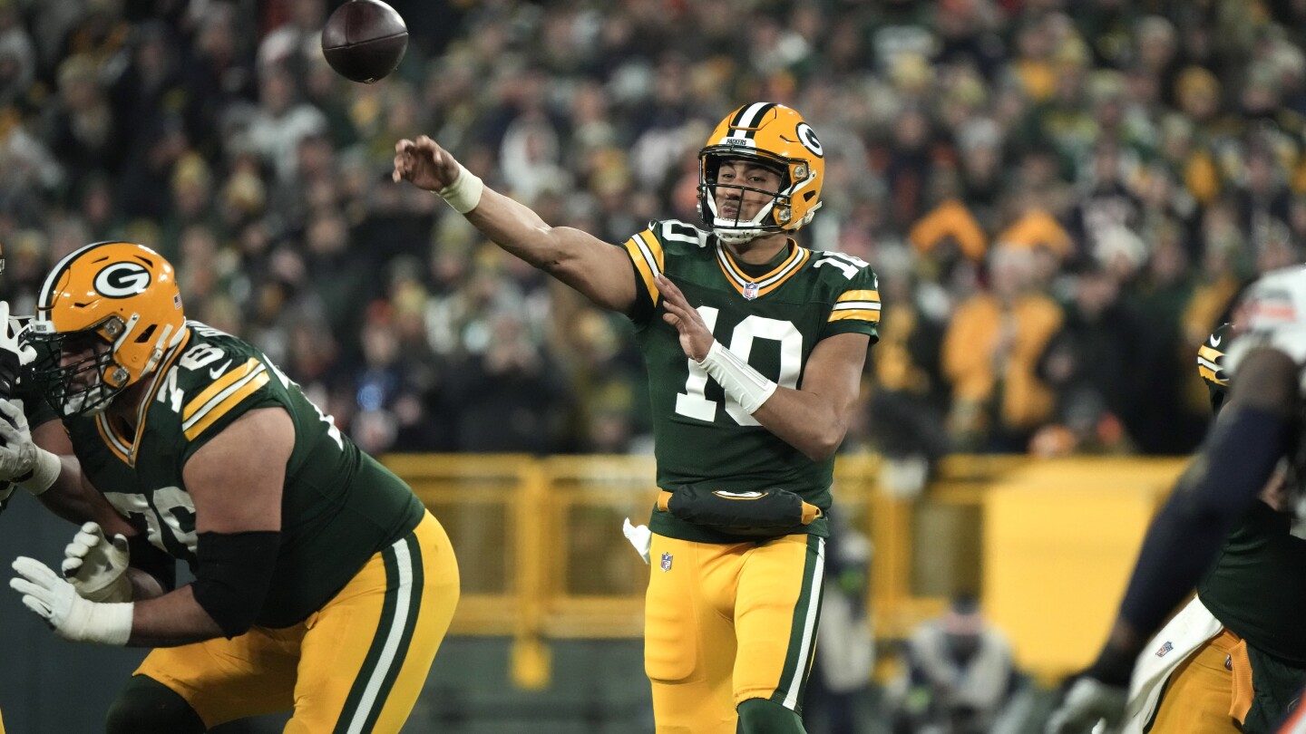 Love comes through as Packers beat Bears 17-9 to clinch a playoff berth | AP News