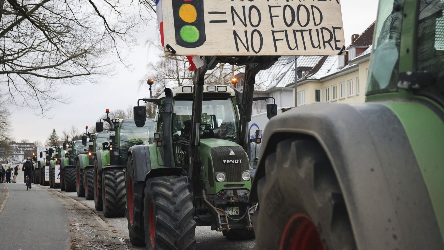 German farmers block roads with tractors and stage protests against plan to scrap diesel tax breaks | AP News