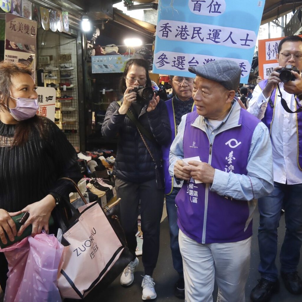 Hong Kongers in Taiwan firmly support the ruling party after watching China erode freedoms at home | AP News