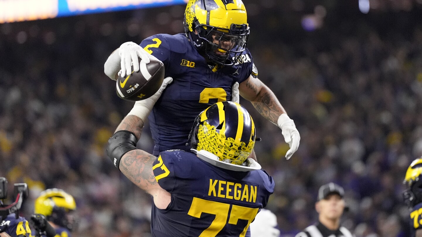 College Football: Michigan Wolverines beat Washington Huskies to win national title  | AP News