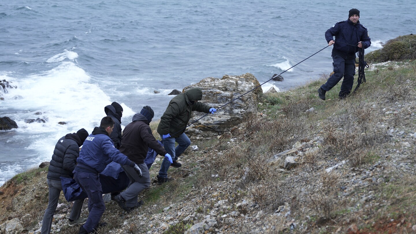 A dinghy carrying migrants hit rocks in Greece, killing 2 people in high winds | AP News