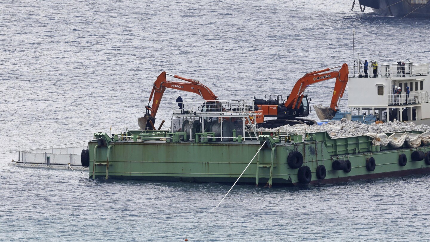 Japan resumes landfill work at new US military site on Okinawa despite local opposition | AP News