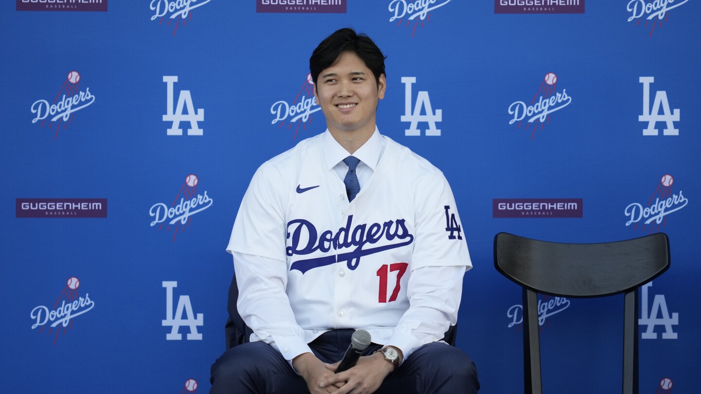 Shohei Ohtani visits US Embassy in Japan and his dog gets mock visa | AP News