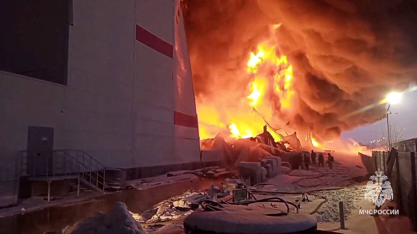 A huge fire engulfs a warehouse in Russia outside the city of St Petersburg | AP News