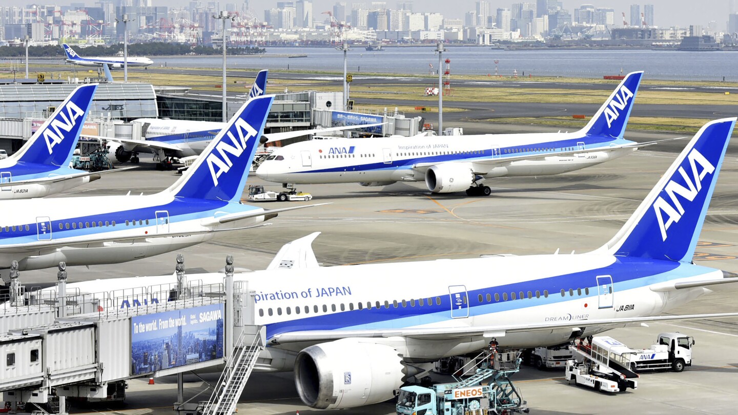 A Japanese domestic flight returns to airport with crack on a cockpit window. No injuries reported. | AP News