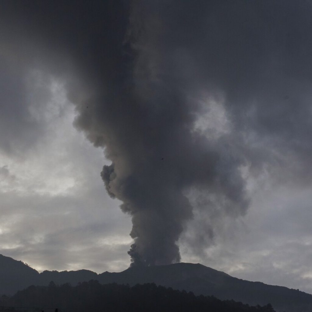 Indonesia evacuates about 6,500 people on the island of Flores after a volcano spews clouds of ash | AP News