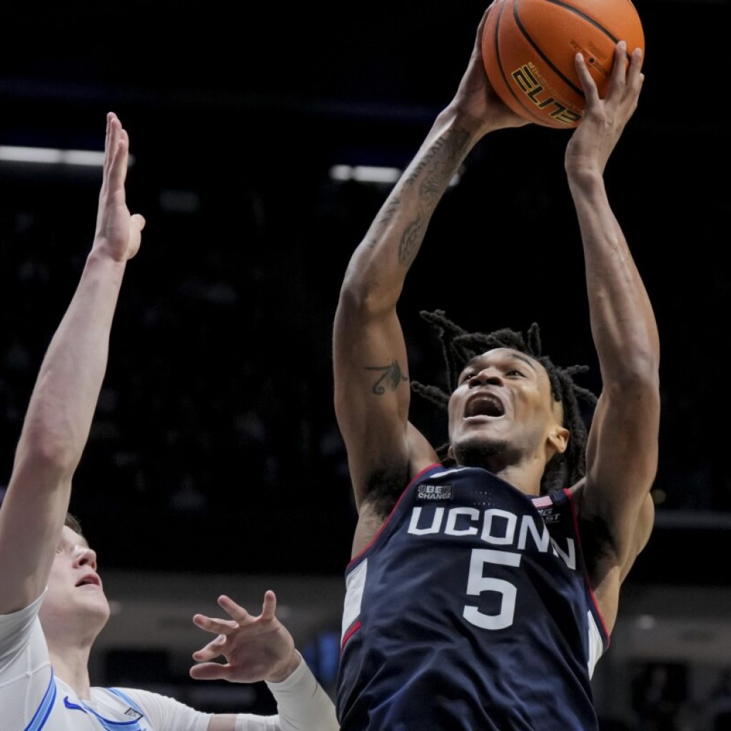 UConn hits No. 1 in AP Top 25 after week of upsets. Gonzaga out for first time since 2016 | AP News