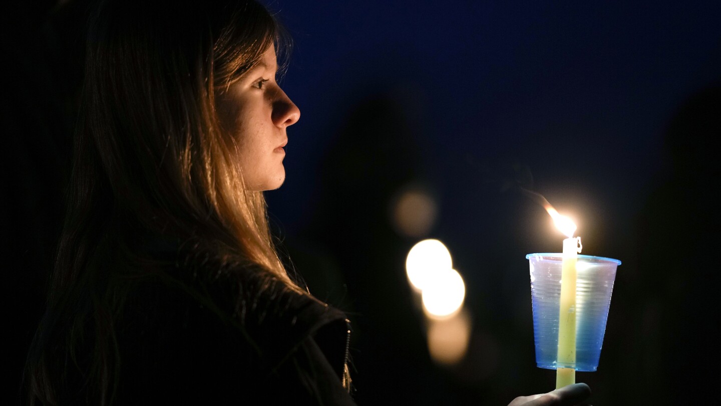 Parents want district to improve security more after deadly Iowa school shooting | AP News