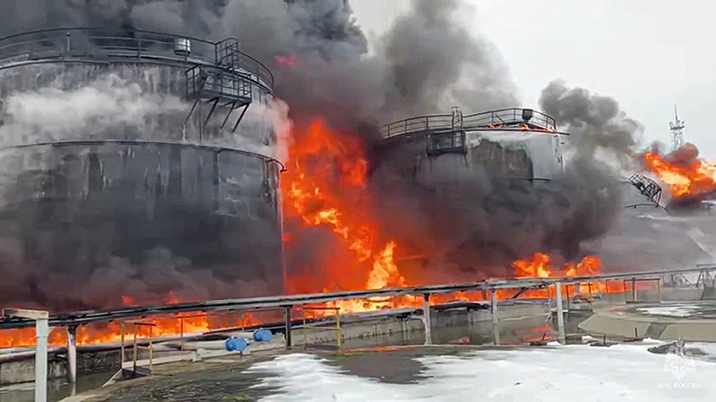 A Ukrainian drone attack on an oil depot inside Russia causes a massive blaze, officials say | AP News