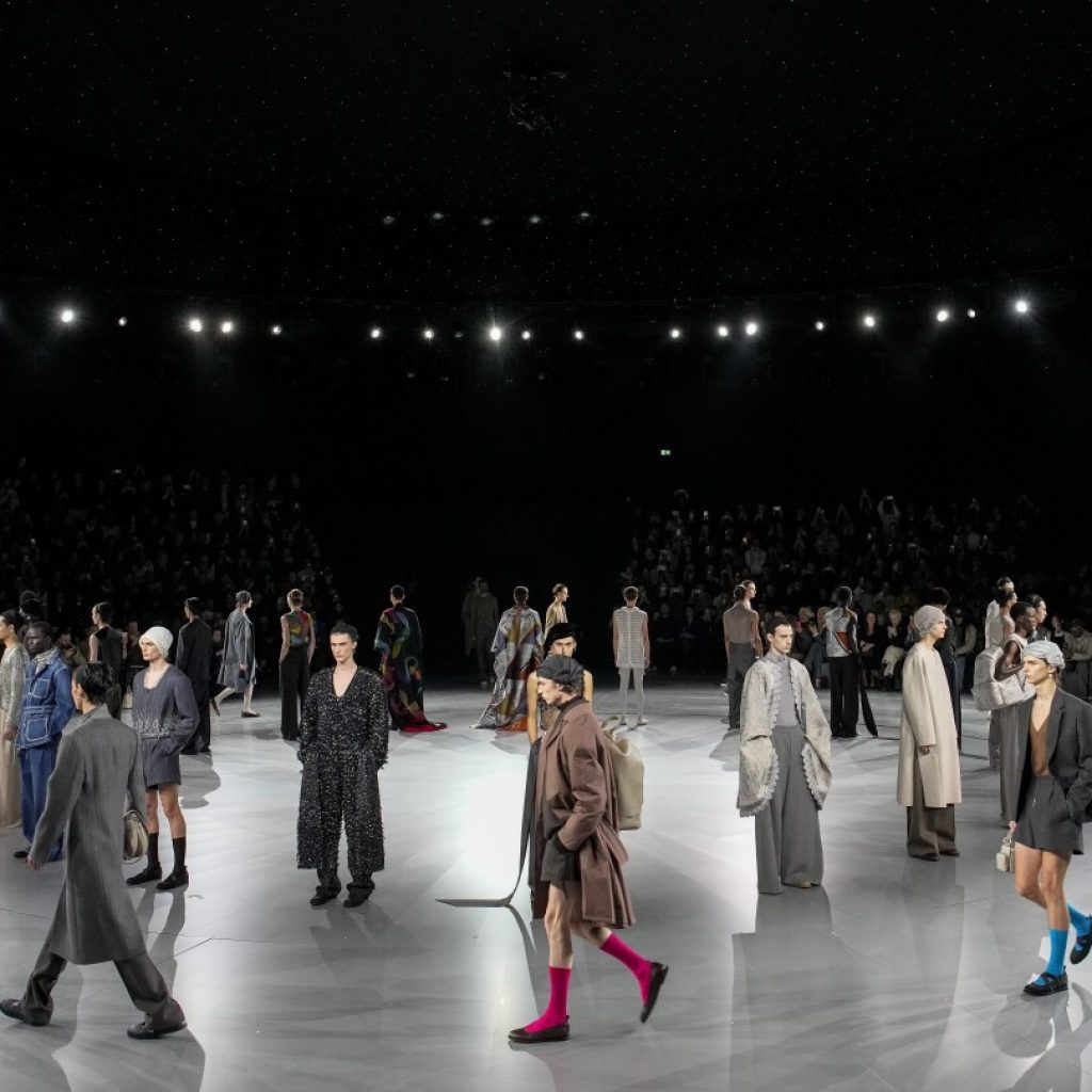 Dior puts on a daytime fashion ballet under the Parisian stars | AP News