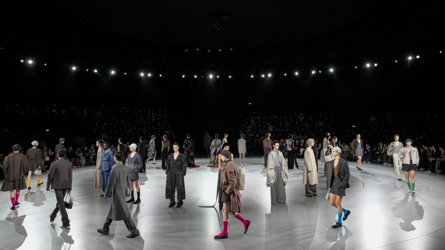 Dior puts on a daytime fashion ballet under the Parisian stars | AP News