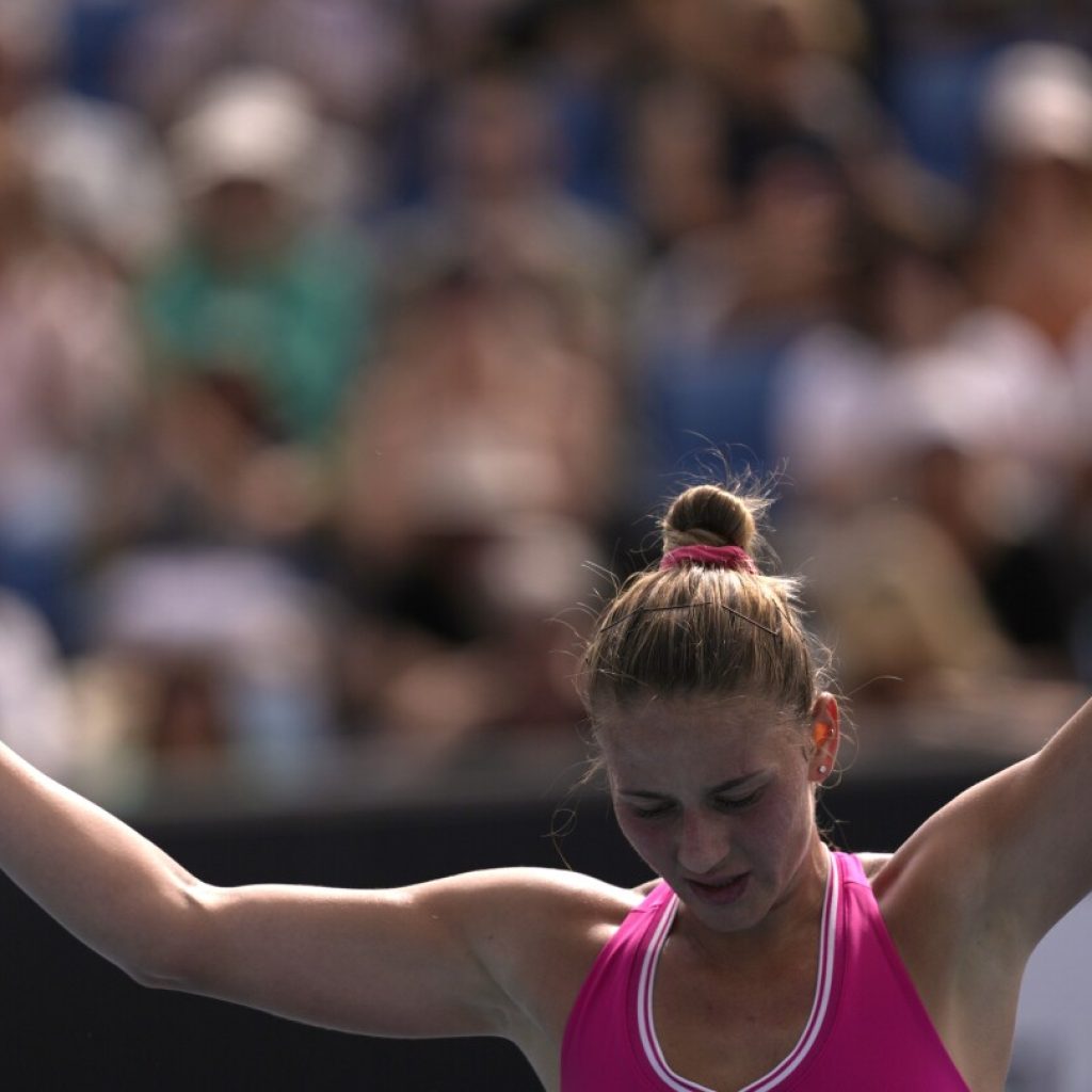 Without handshakes, Ukrainian players trying to keep message alive at Australian Open | AP News