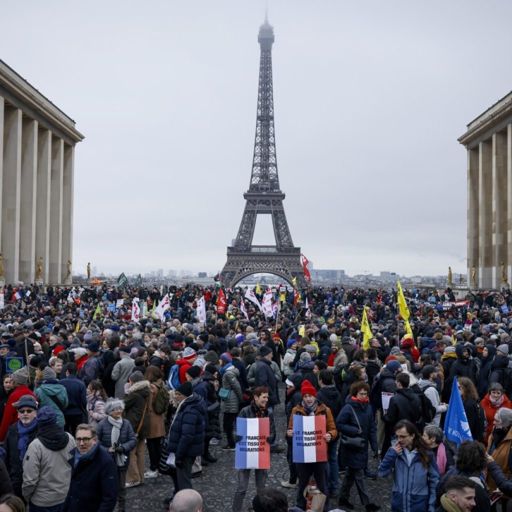 French protesters ask Macron not to sign off on an immigration law with a far-right footprint | AP News