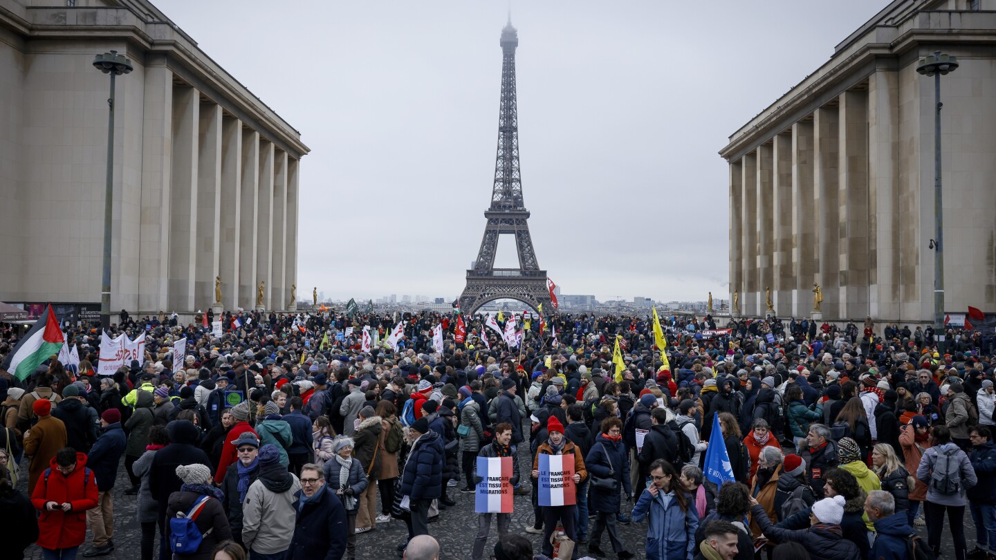 French protesters ask Macron not to sign off on an immigration law with a far-right footprint | AP News