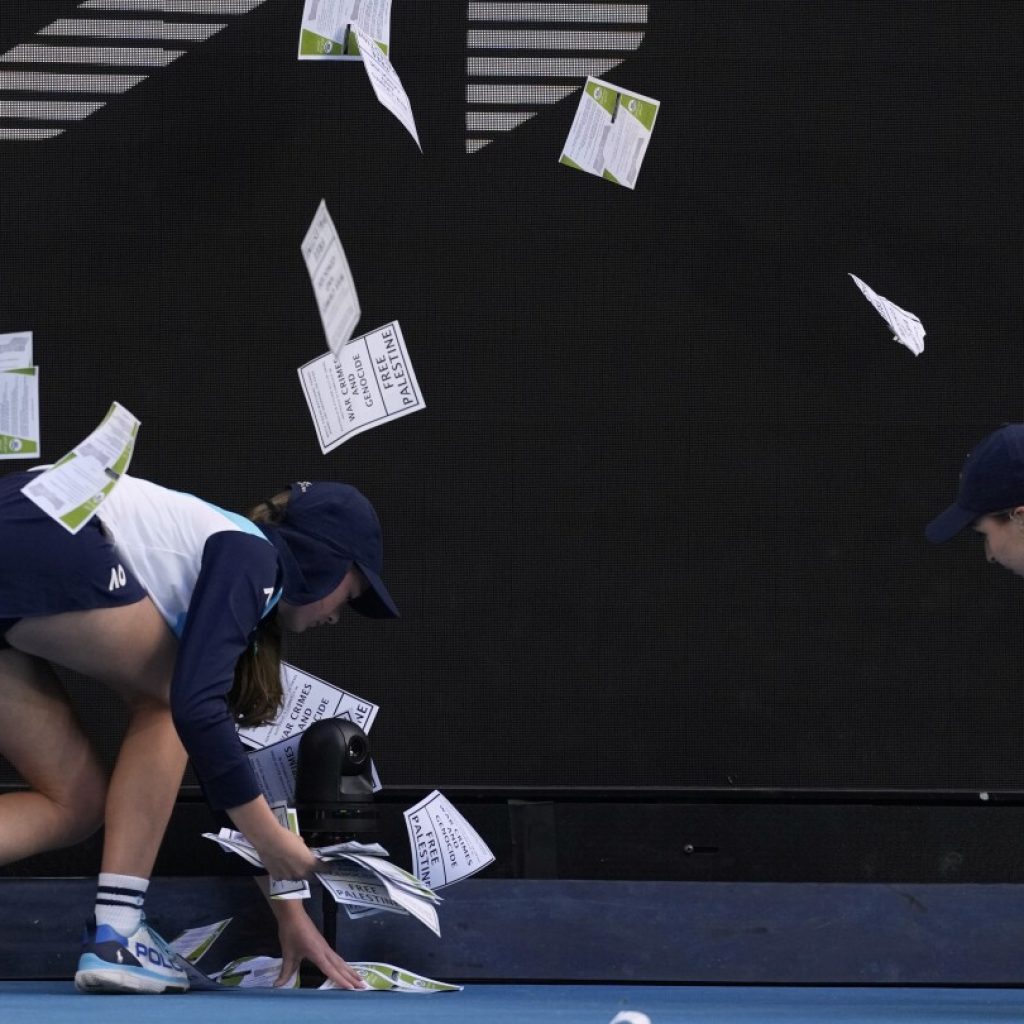 Protestor throws papers on court, briefly delaying Australian Open match between Zverev and Norrie | AP News