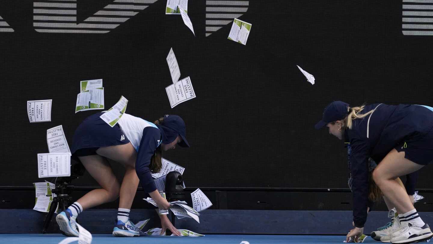 Protestor throws papers on court, briefly delaying Australian Open match between Zverev and Norrie | AP News