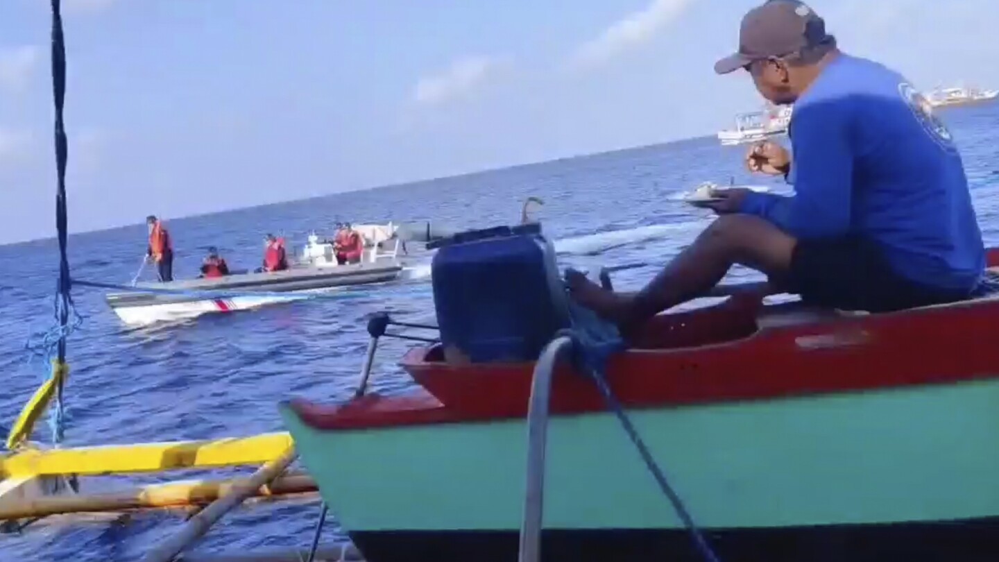 Filipino fisherman to Chinese coast guard in disputed shoal: `This is not your territory. Go away.’ | AP News