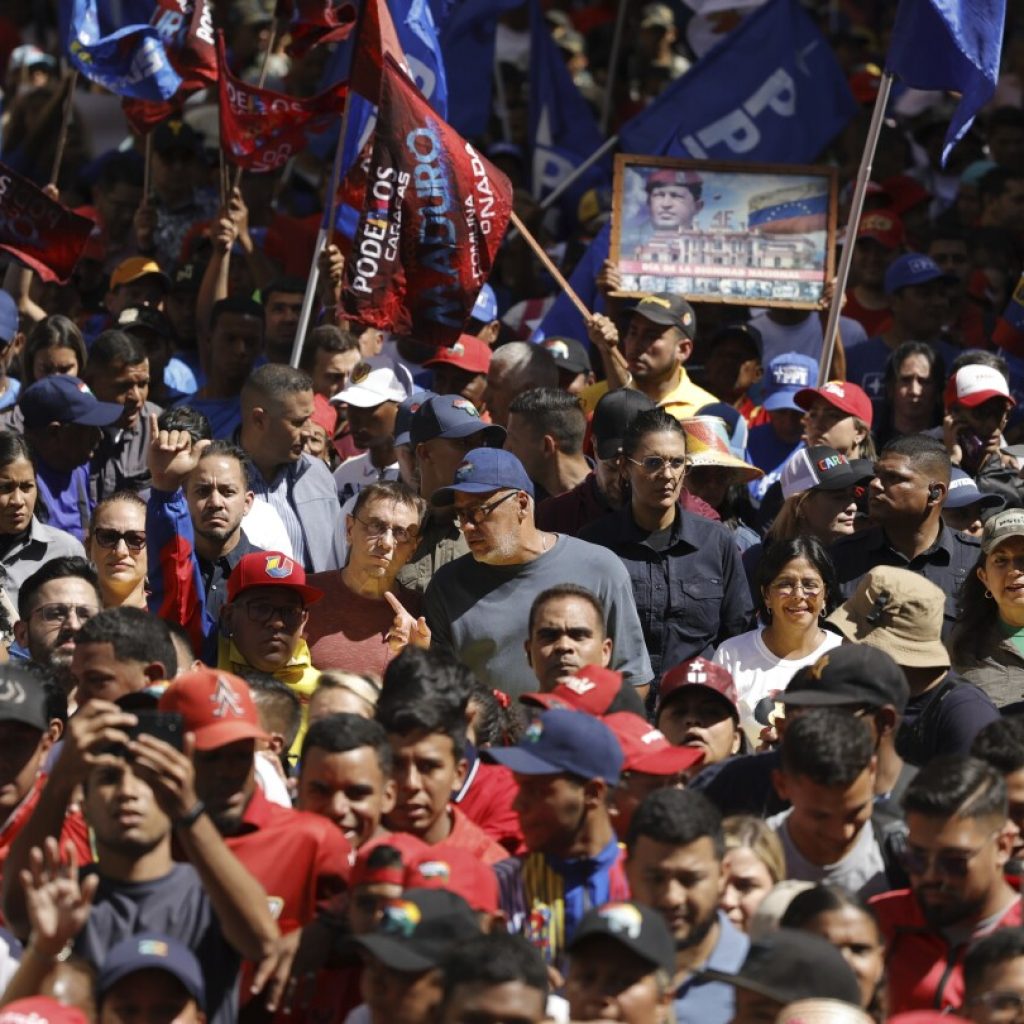 Dueling political factions demonstrate in Venezuela’s capital as presidential election race heats up | AP News