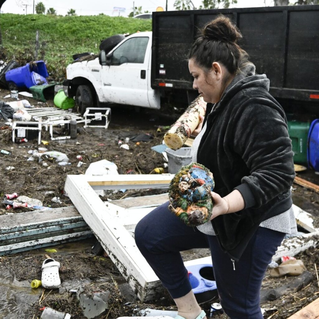 San Diego floods: Residents cry and hug outside damaged homes | AP News