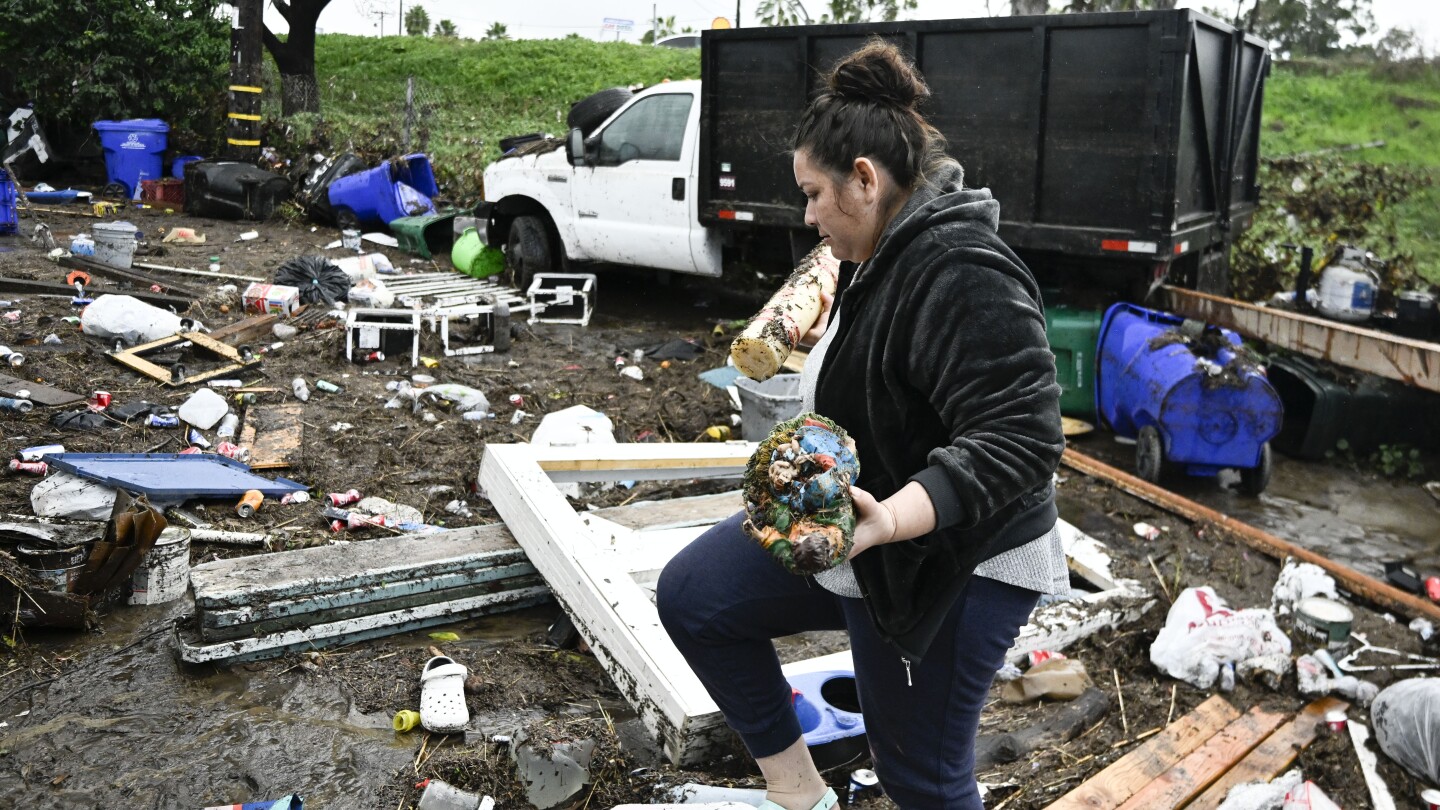 San Diego floods: Residents cry and hug outside damaged homes | AP News