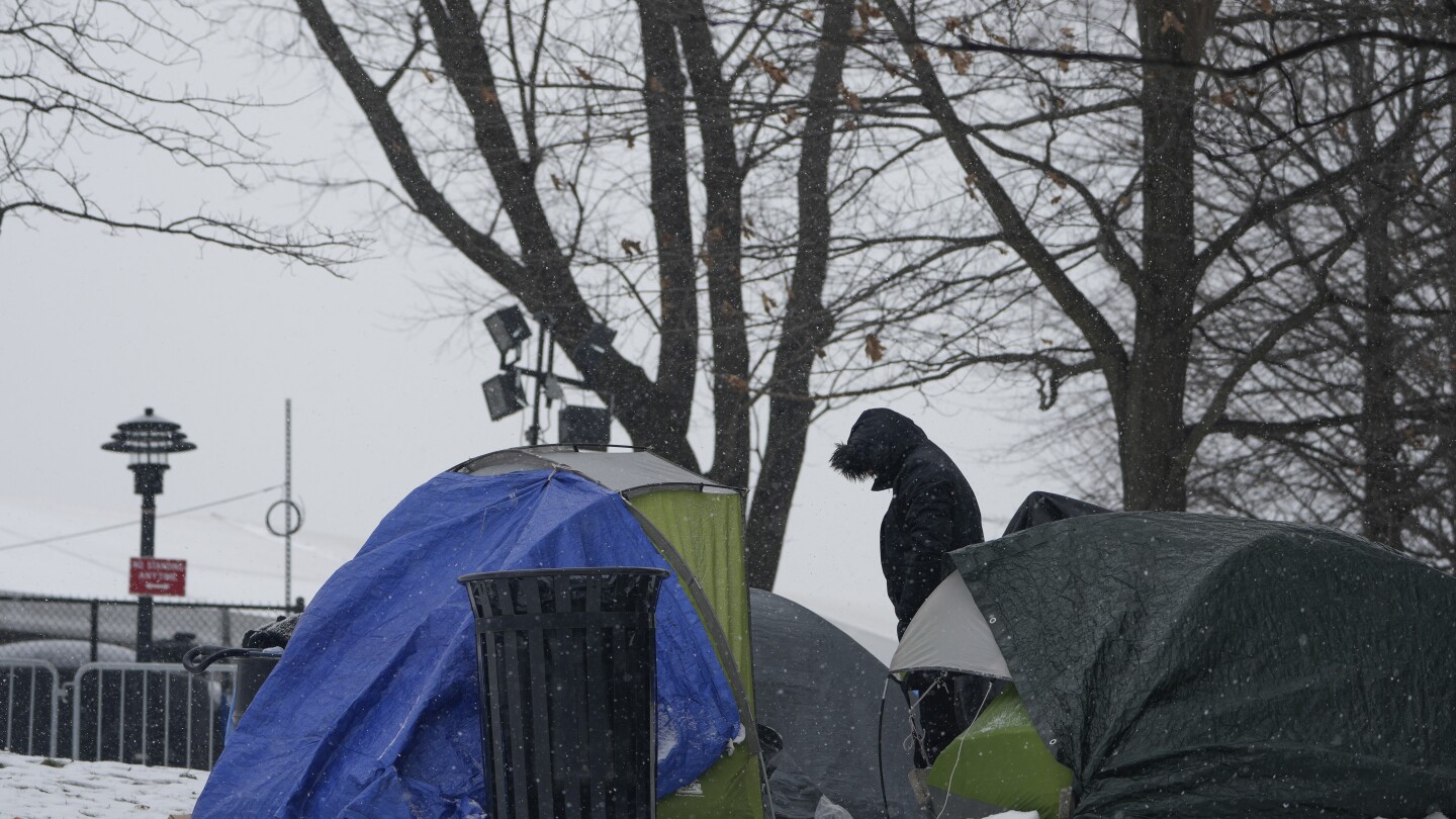 With beds scarce and winter bearing down, a tent camp grows outside NYC’s largest migrant shelter | AP News