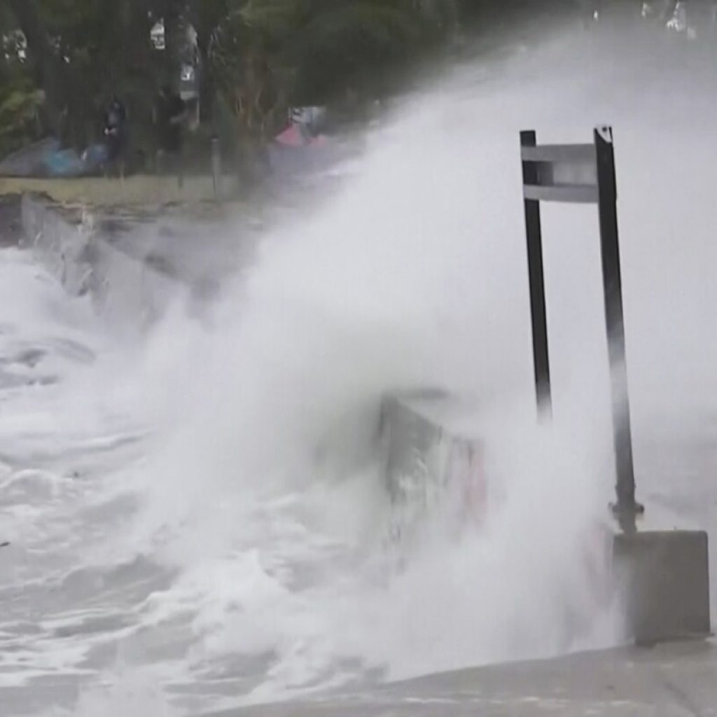 Storm hits Australia with strong winds and power outages, but weakens from cyclone to tropical storm | AP News