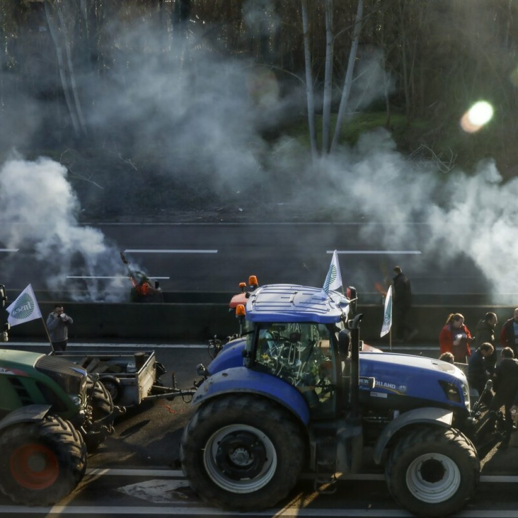 French farmers vow to continue protesting despite the government’s offer of concessions | AP News