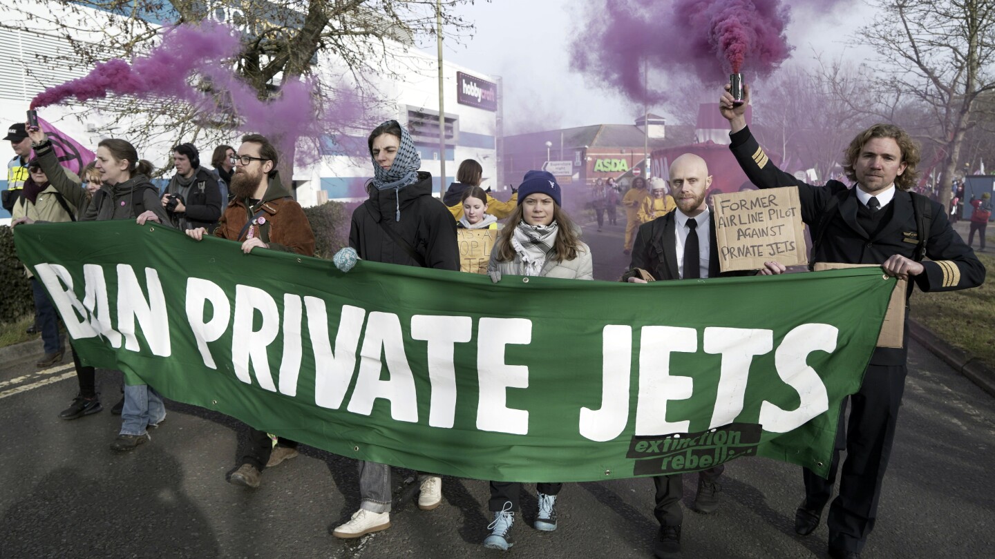 Greta Thunberg joins hundreds marching in England to protest airport’s expansion for private planes | AP News