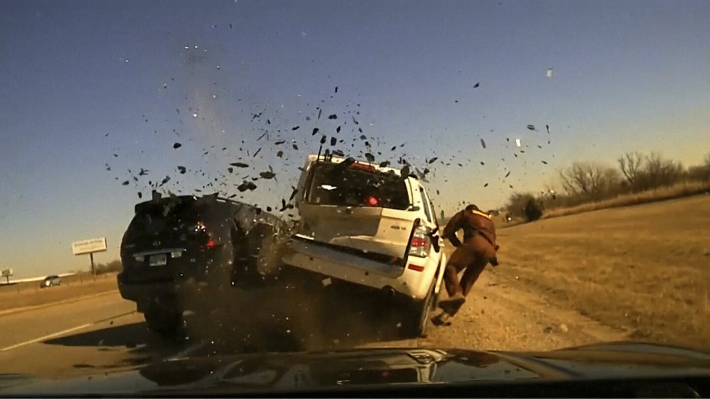 Oklahoma trooper violently thrown to the ground as vehicle on interstate hits one he’d pulled over | AP News