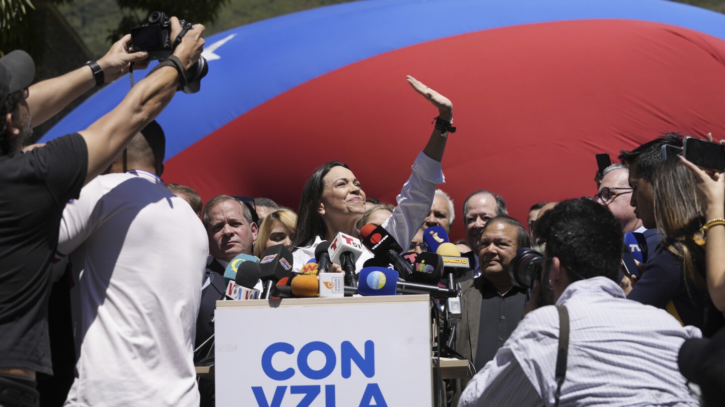 Venezuelan opposition candidate blocked by court calls it ‘judicial criminality,’ won’t abandon race | AP News