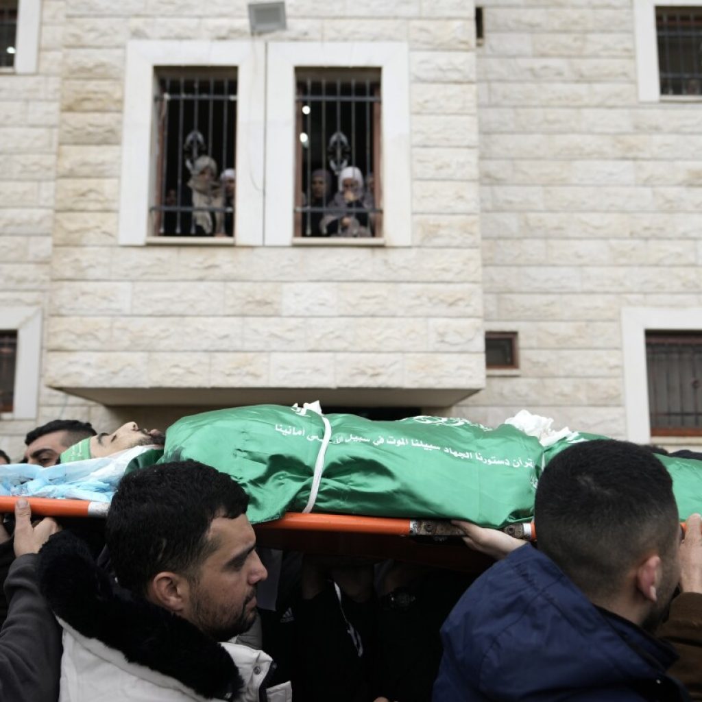 Israeli forces dressed as women and medics storm West Bank hospital | AP News