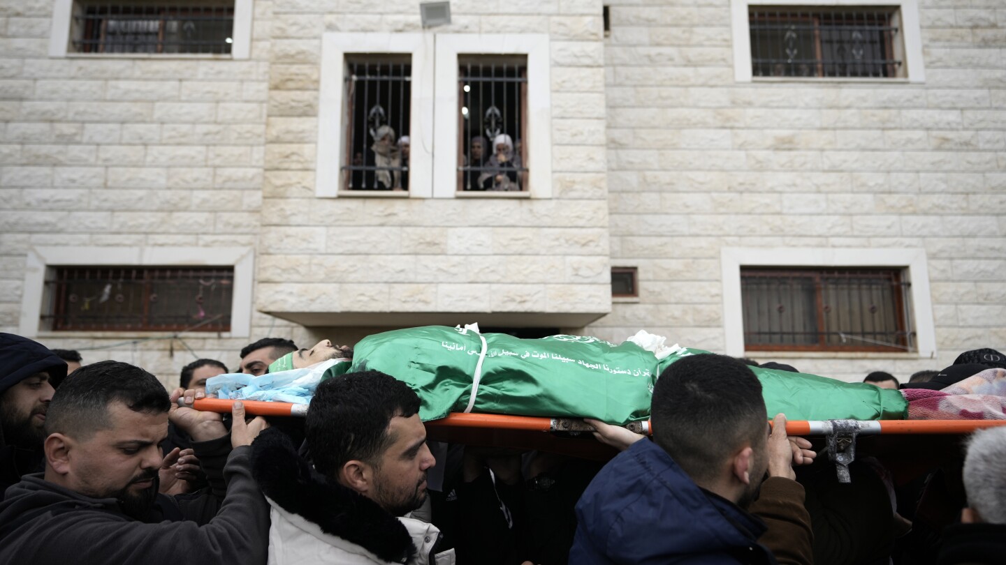 Israeli forces dressed as women and medics storm West Bank hospital | AP News