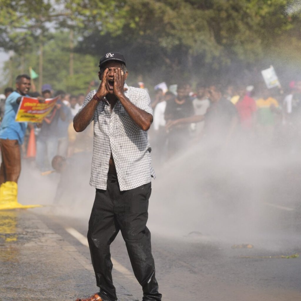 Police in Sri Lanka use tear gas to disperse opposition protest against dire economic conditions | AP News