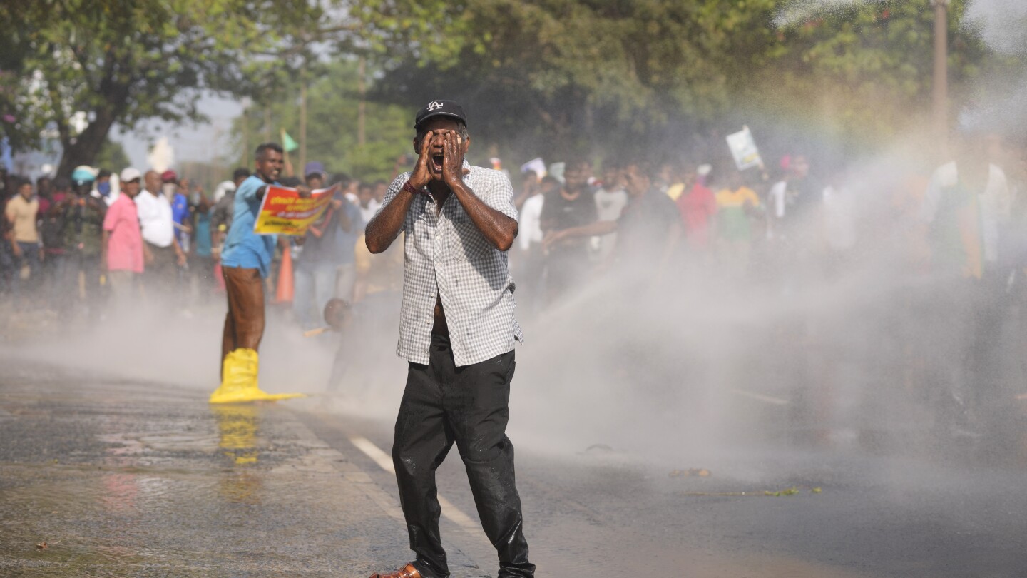 Police in Sri Lanka use tear gas to disperse opposition protest against dire economic conditions | AP News