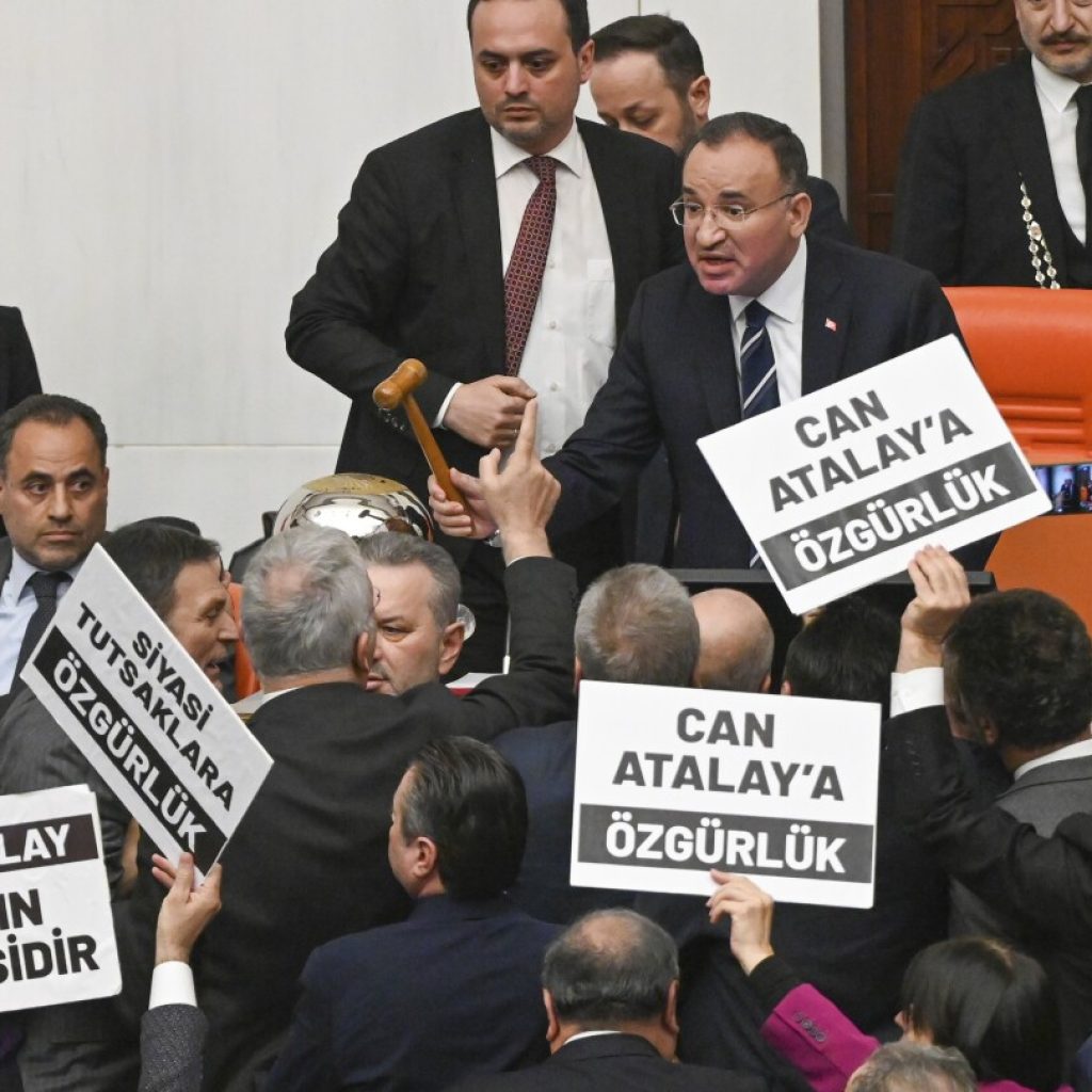 Turkish parliament strips imprisoned opposition lawmaker of seat | AP News