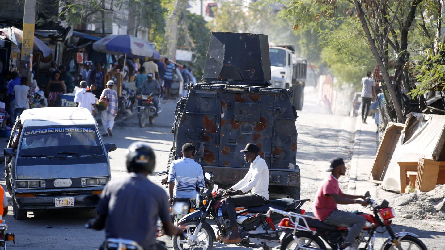 Haiti pushes forward with new program to boost police department overwhelmed by gangs | AP News