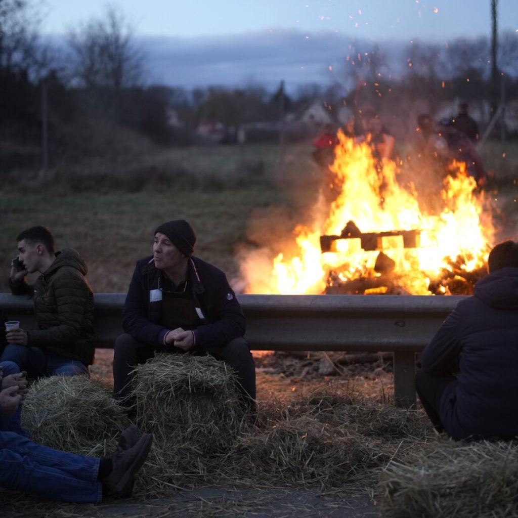 Protesting farmers have France’s government in a bind | AP News