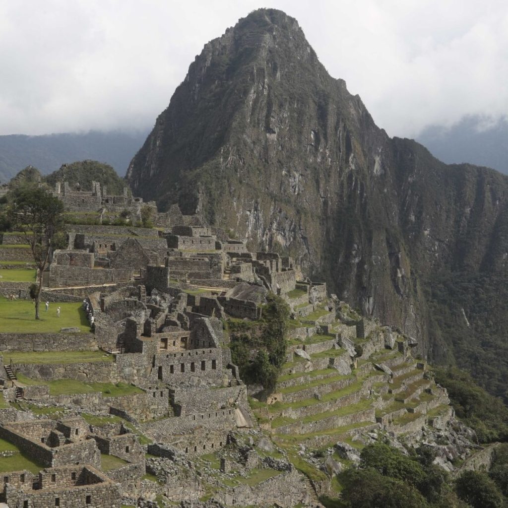 Peru gives in to protesters in Machu Picchu and rescinds ticket sales contract with private firm | AP News