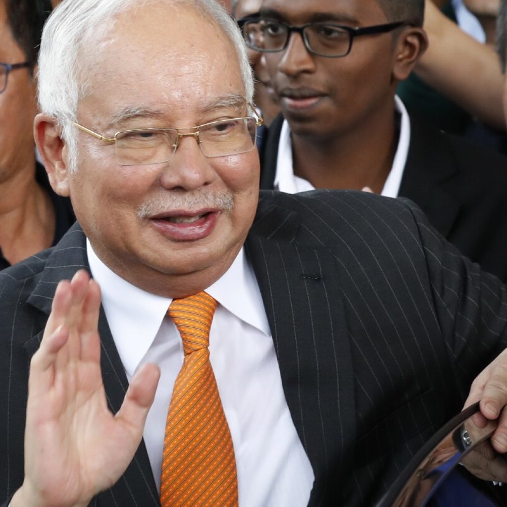 Malaysia halves prison term for ex-Prime Minister who oversaw multibillion-dollar 1MDB thefts | AP News