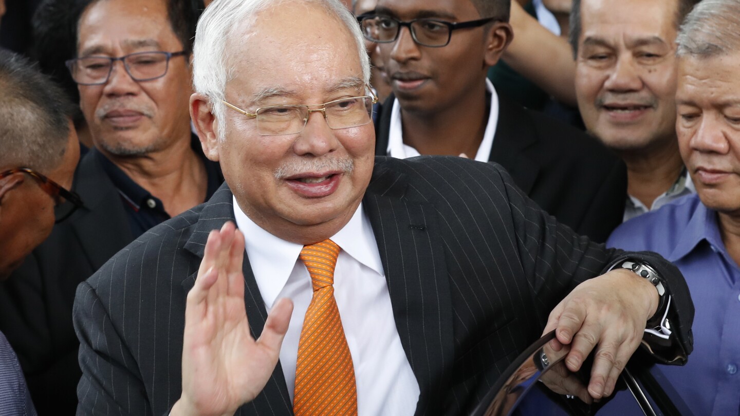 Malaysia halves prison term for ex-Prime Minister who oversaw multibillion-dollar 1MDB thefts | AP News