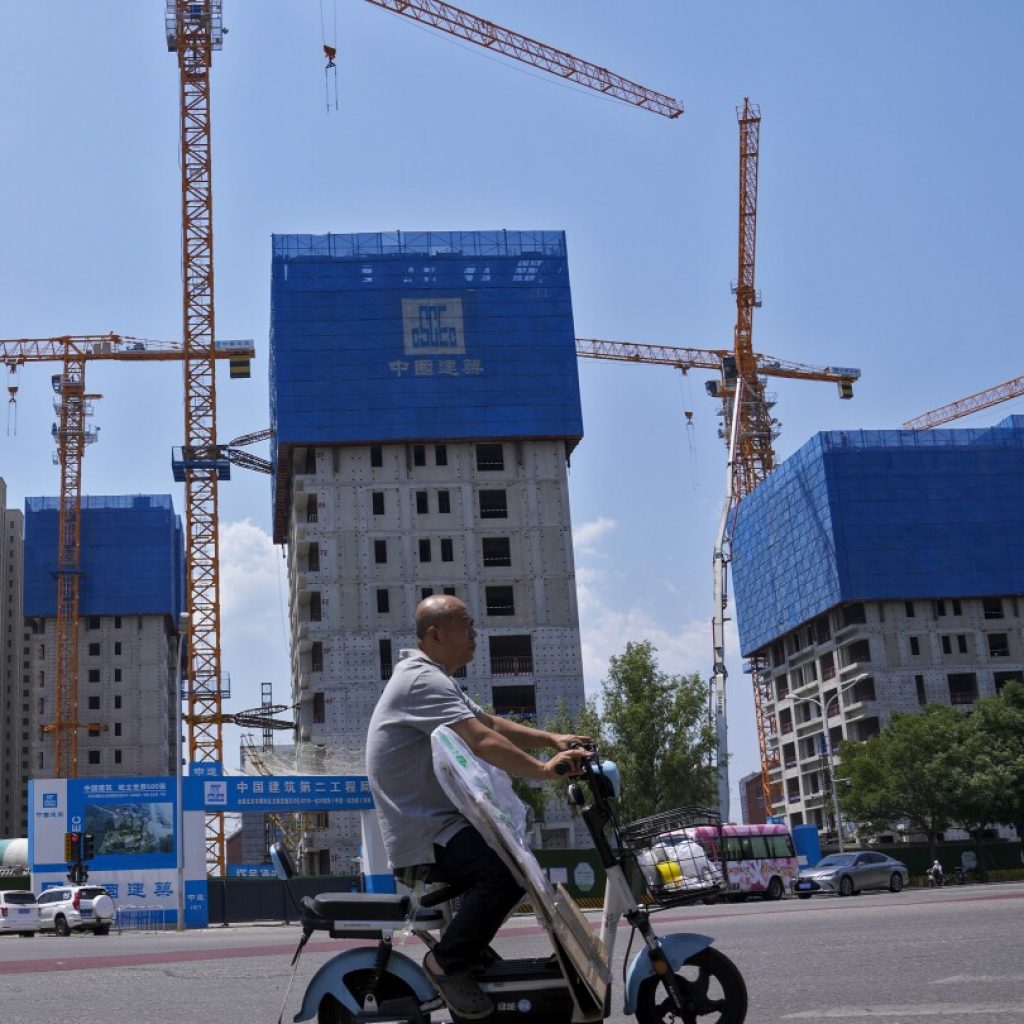 China pledges more help for its ailing property market, as IMF forecasts economy will slow | AP News