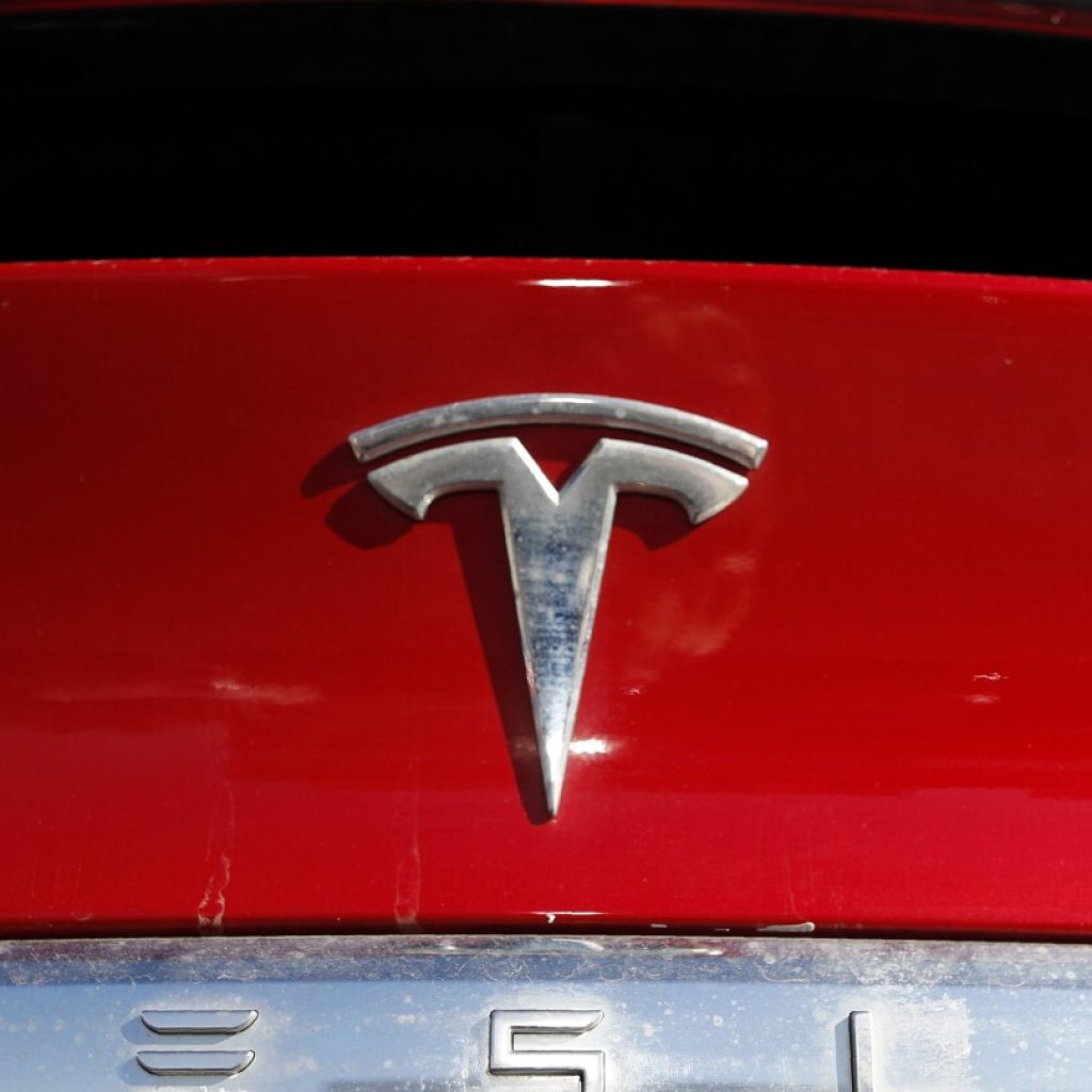 Tesla recalling nearly 2.2M vehicles to fix warning lights that are too small | AP News