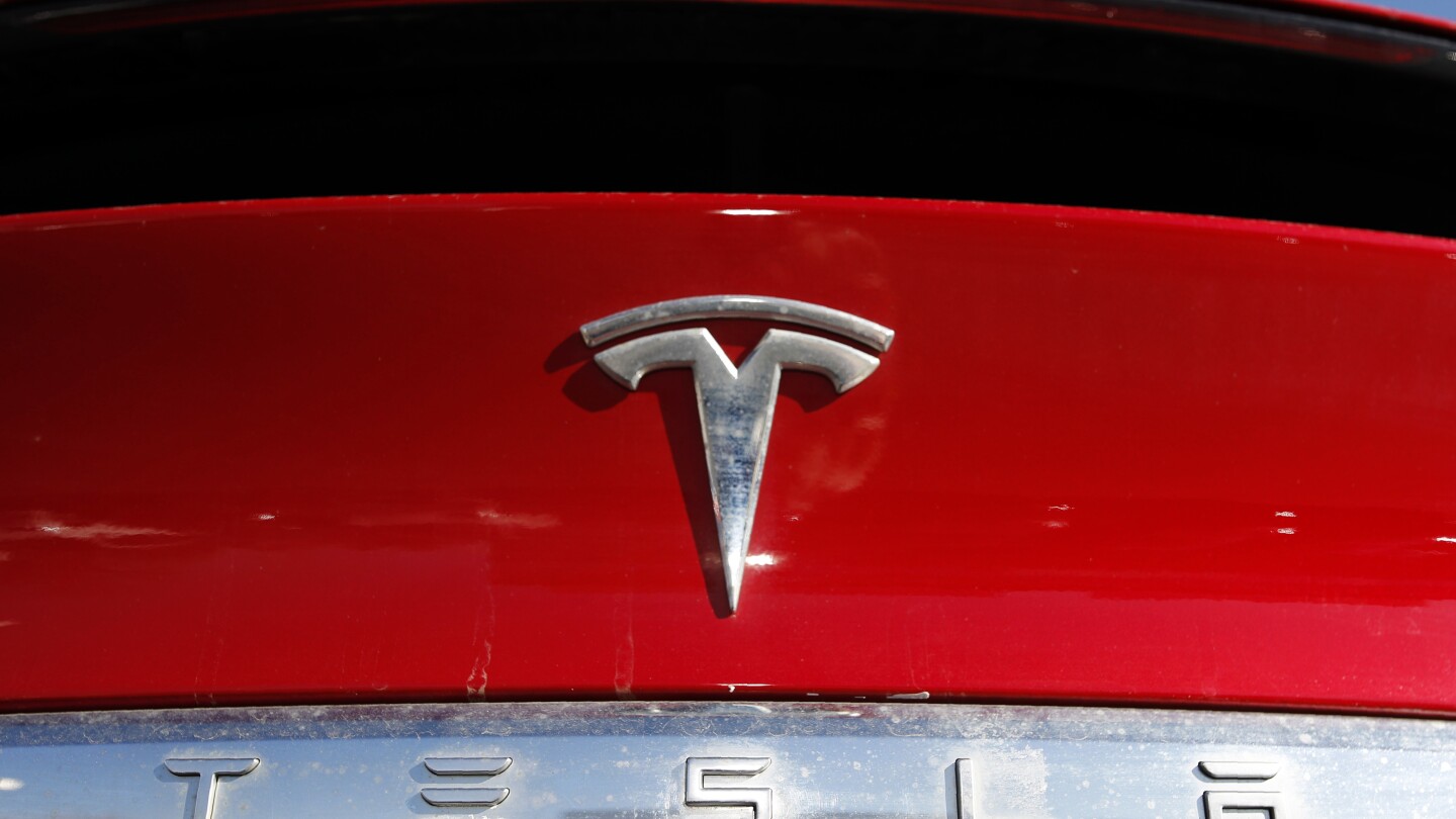 Tesla recalling nearly 2.2M vehicles to fix warning lights that are too small | AP News