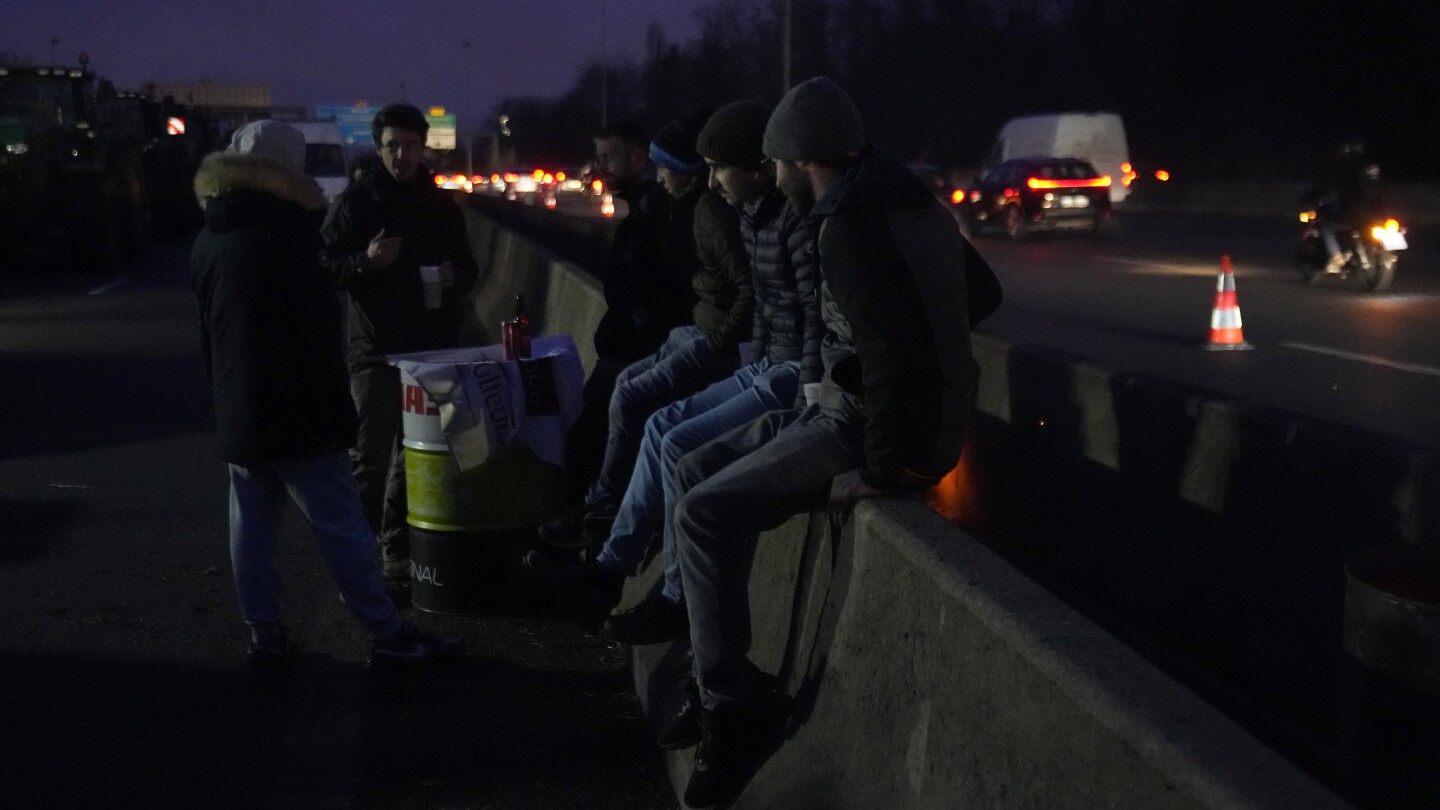 Farmers are blocking key roads between Belgium and the Netherlands in the latest sign of their anger | AP News